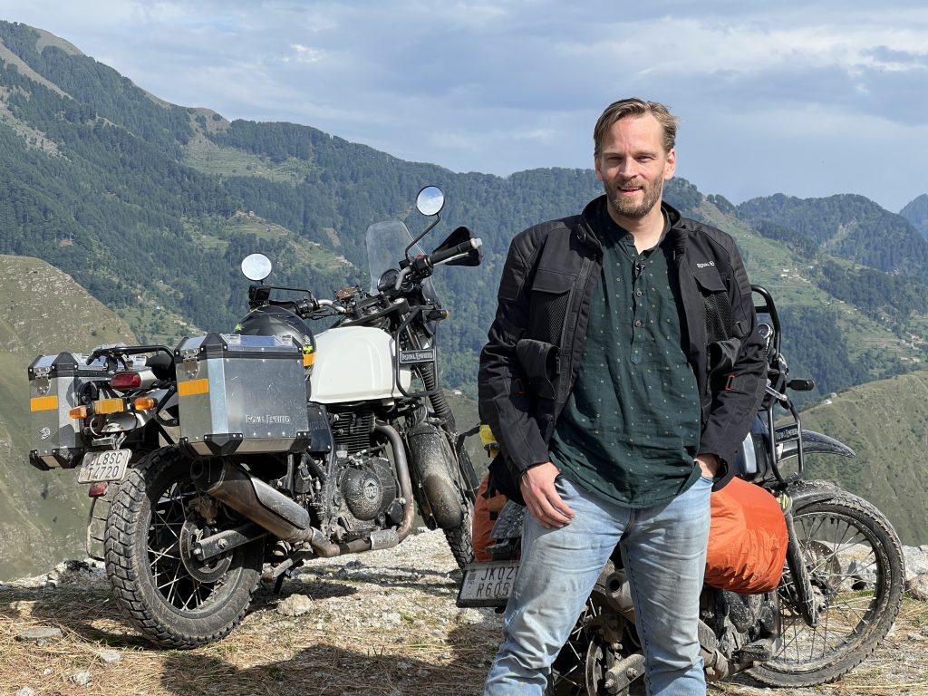 Karl Rock posing with motorcycles